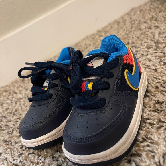 Nike infant shoes size 4C with blue swoosh and yellow trim, and red and black. - Picture 2 of 4